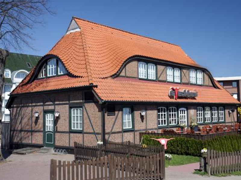 Das Steakhus in einem Haus mit rotem Dach